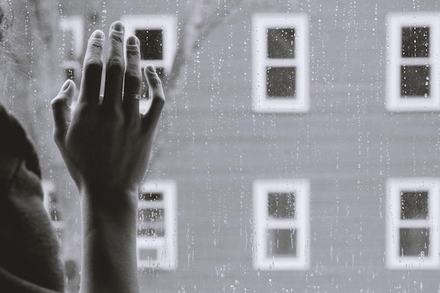 Why Are American Women Over 40 the Biggest Antidepressant Market from Wile, woman's hand on rainy window