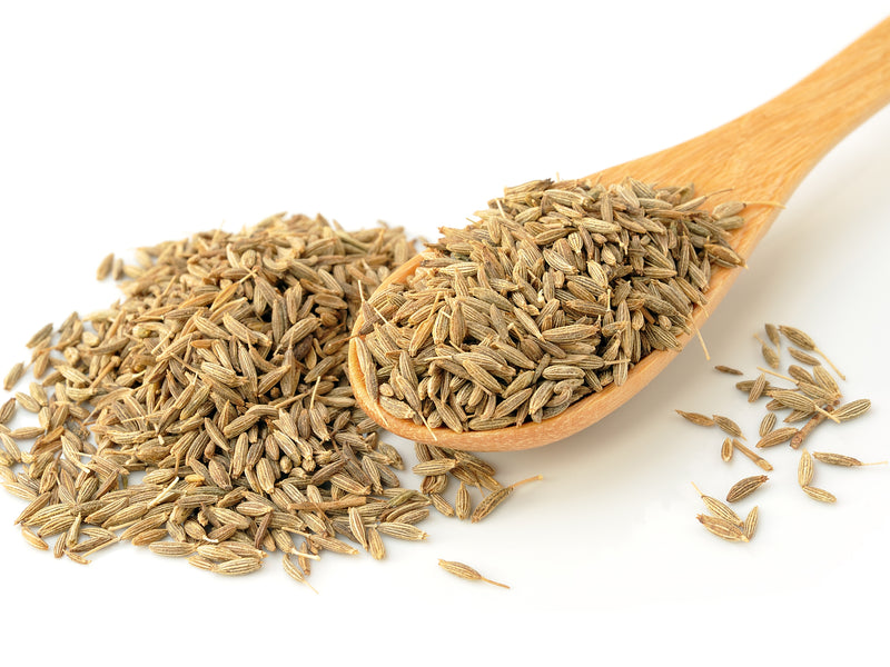 Fennel for Hormonal Wellness and Perimenopause Support from Wile. ID: a wooden spoon with small brown fennel seeds on a white background